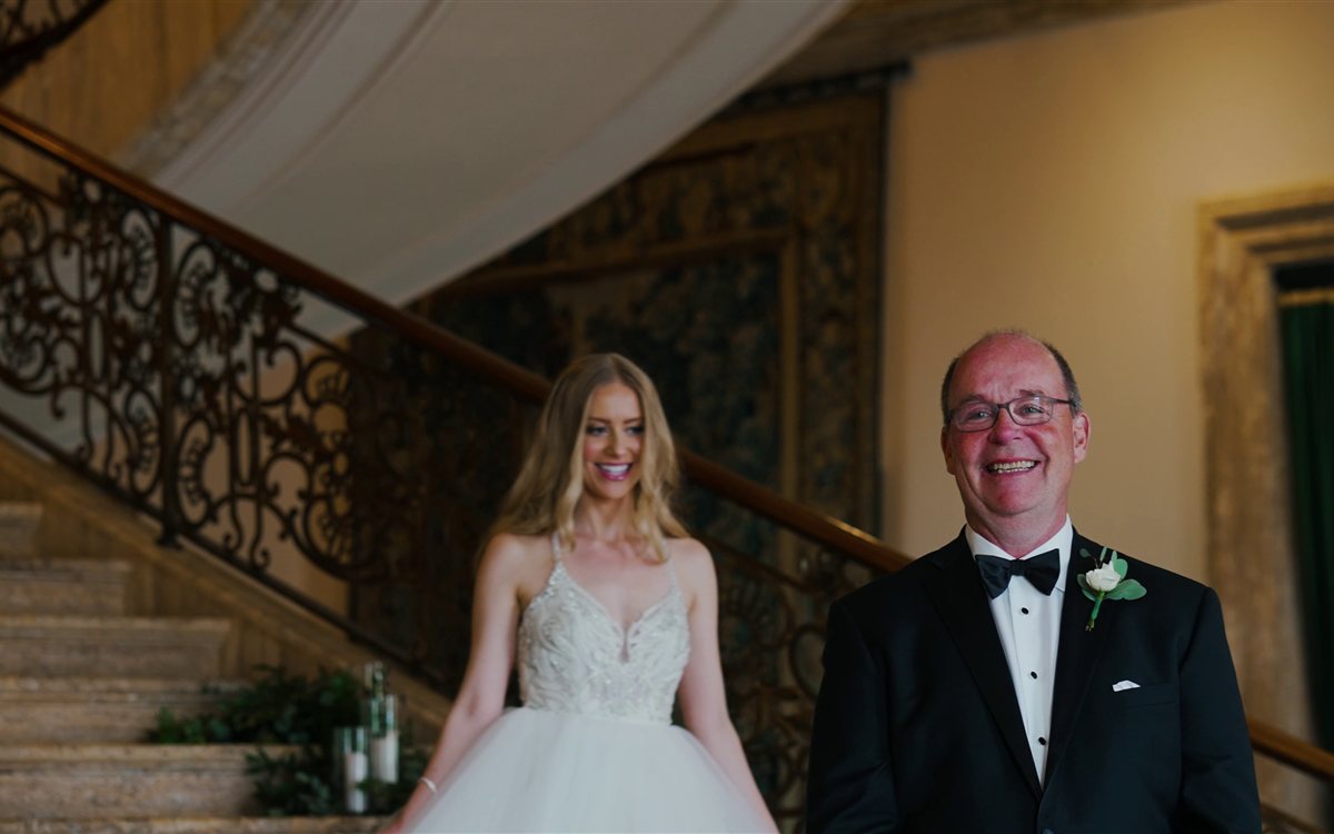 Jasna Polana Wedding Videography Hillary and her father laughing on the grand staircase